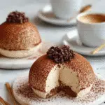 Cocoa-Dusted Tiramisu Domes served with espresso and chocolate shavings