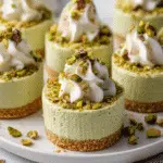 no-bake mini pistachio cheesecakes on a white plate