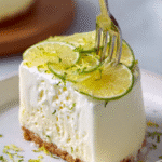 Velvety lemon parfait with biscuit base and lime garnish